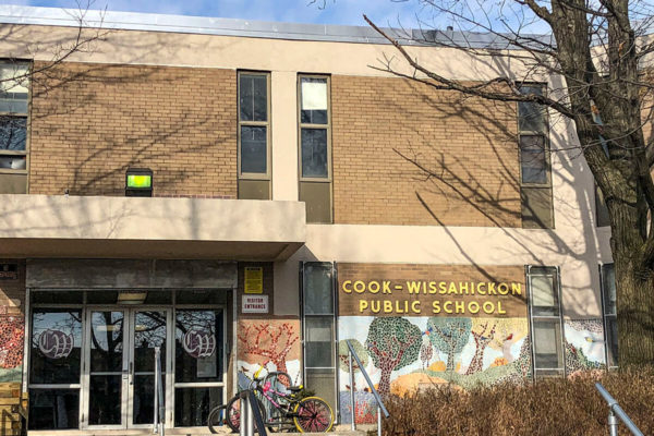 Exterior photo of Cook Wissahickon School. Premier Building Restoration crew completed concrete patching, concrete coating, brick replacement, brick pointing, caulking, and facade cleaning to transform and protect the building.