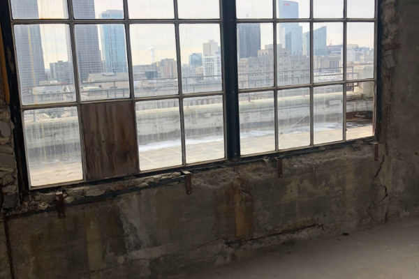 Interior photo of 411 N 20th Street. Before Premier Building Restoration completed concrete repairs and concrete patching to transform the building from an industrial to a residential use. It is an excellent example of adaptive reuse and Premier's expertise in project management.